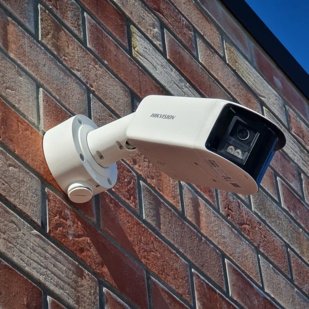 4K bullet camera on brick exterior